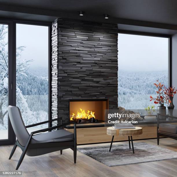 sala de estar minimalista de estilo escandinavo moderno con chimenea de piedra de pizarra negra - chimenea fotografías e imágenes de stock