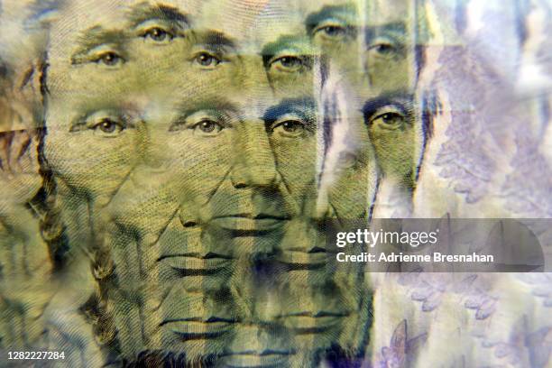 kaleidoscope currency - abraham lincoln five dollars - abraham lincoln stock pictures, royalty-free photos & images