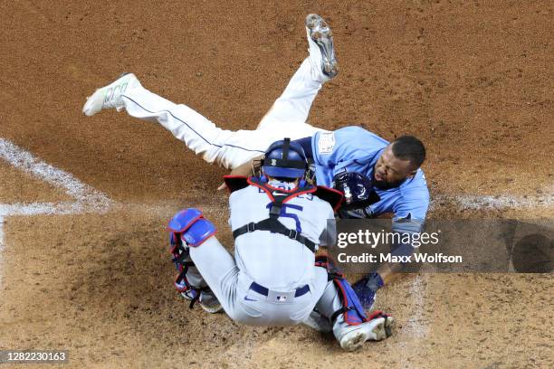 Manuel Margot of the Tampa Bay Rays is tagged out by Austin Barnes of the Los Angeles Dodgers on an attempt to steal home during the fourth inning in...