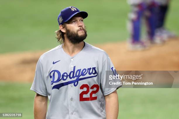 Clayton Kershaw of the Los Angeles Dodgers reacts as he is taken out of the game against the Tampa Bay Rays during the sixth inning in Game Five of...