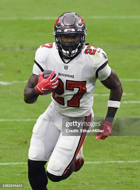 Running back Ronald Jones II of the Tampa Bay Buccaneers runs for yardage against the Las Vegas Raiders during the first half of their game at...