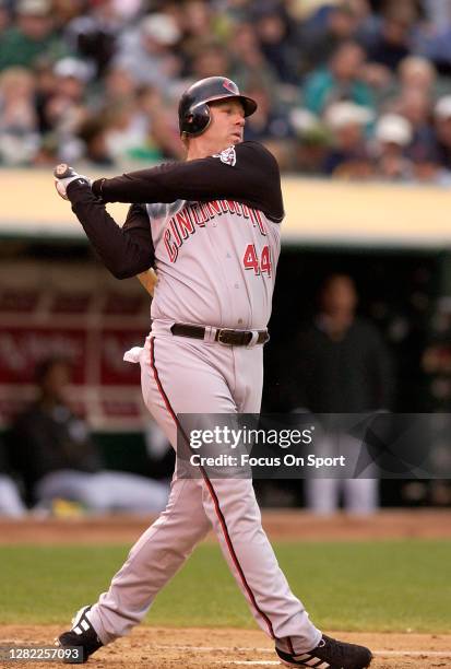 Adam Dunn of the Cincinnati Reds bats against the Oakland Athletics during an Major League Baseball game June 9, 2004 at the Oakland-Alameda County...