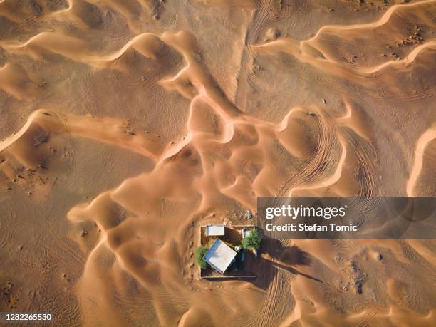 lonely mosque surrounded by desert and the sand dunes in sharjah emirate of uae - dubai aerial stock pictures, royalty-free photos & images