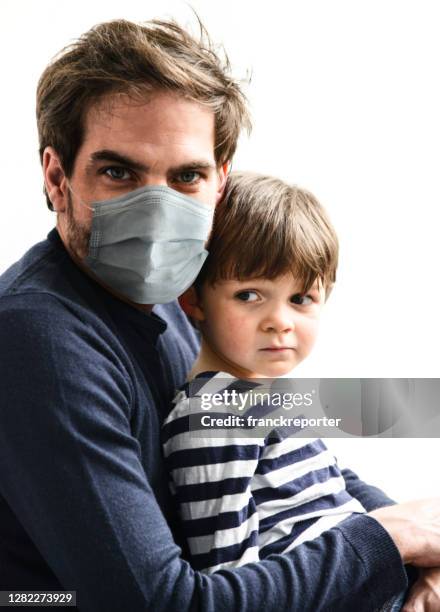 father and son sad with face mask - crying baby in shop stock pictures, royalty-free photos & images