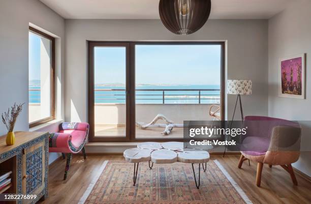 living room in the holiday apartment - window dresser stock pictures, royalty-free photos & images