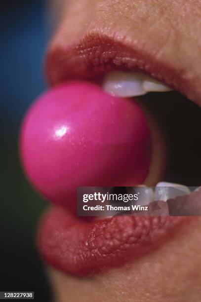 teeth biting into bubble gum - chewing bubble gum stock pictures, royalty-free photos & images