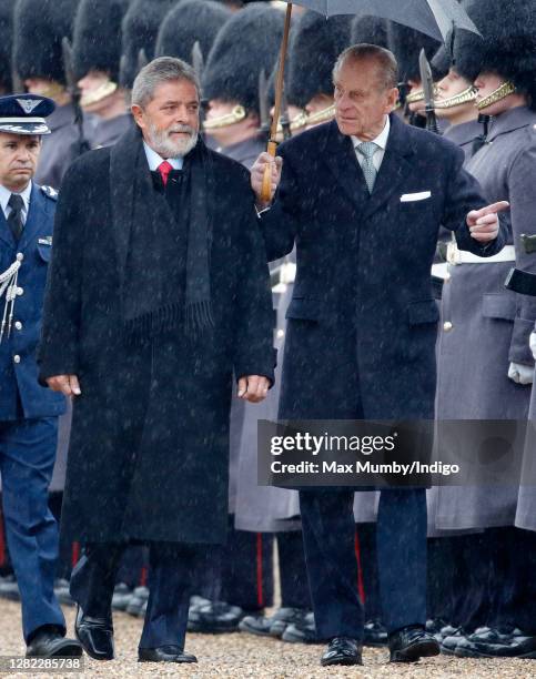 Prince Philip, Duke of Edinburgh and President of Brazil Luiz Inácio Lula da Silva inspect a guard of honour as they attend the ceremonial welcome at...