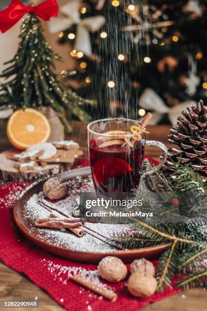 christmas mulled wine glühwein with spices and christmas tree - cosy christmas stock pictures, royalty-free photos & images