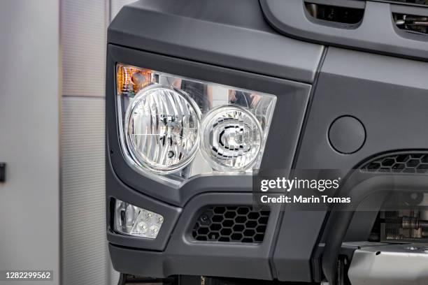 modern truck headlight - parachoques fotografías e imágenes de stock