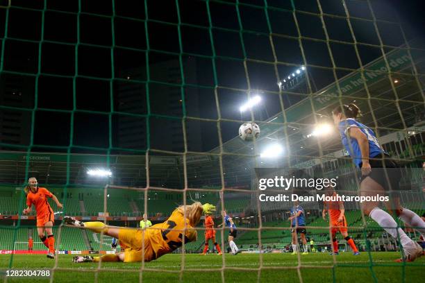 Katja Snoeijs of the Netherlands shoots and scores a goal [past Goalkeeper, Karina Kork of Estonia during the UEFA Women's EURO 2022 qualifier match...