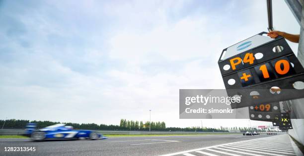 racing car driving track - scoring stock pictures, royalty-free photos & images