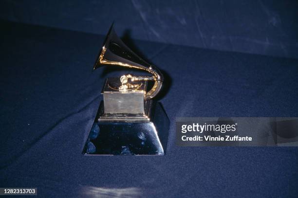 Gold-plated Grammy trophy, depicting a gilded gramophone, at the 38th Annual Grammy Awards, held at the Shrine Auditorium, Los Angeles, California,...