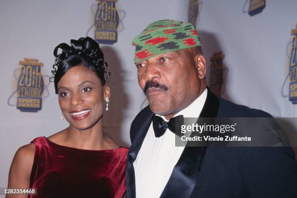 American former professional football player Jim Brown and his wife, Monique, attend the Sports Illustrated 20th Century Sports Awards, held at...