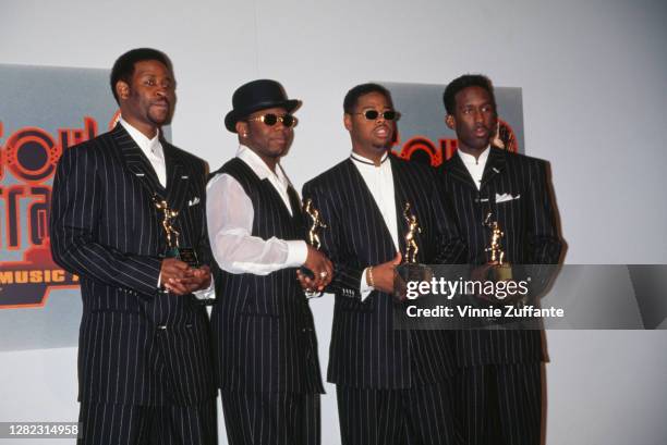 American R&B vocal group Boyz II Men , holding their 'Entertainer of the Year' awards, attend the 10th Annual Soul Train Music Awards, held at the...