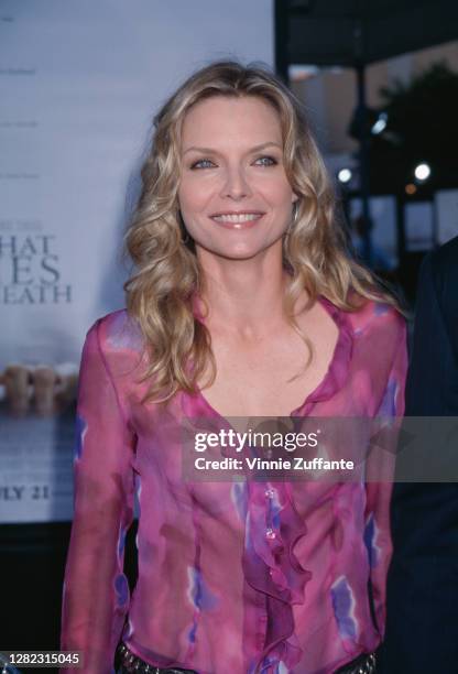 American actress Michelle Pfeiffer attends the premiere of 'What Lies Beneath', held at the Mann Village Theater in Los Angeles, California, 18th...