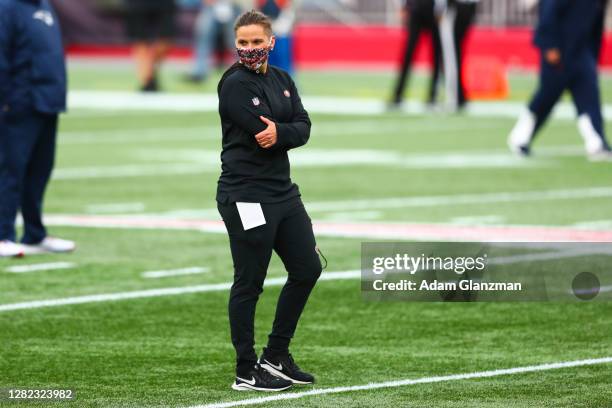 Coach Katie Sowers of the San Francisco 49ers looks on before a game against the New England Patriots on October 25, 2020 in Foxborough,...