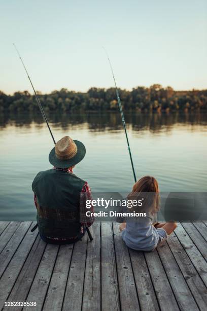 these fishes stand no chance - rod stock pictures, royalty-free photos & images