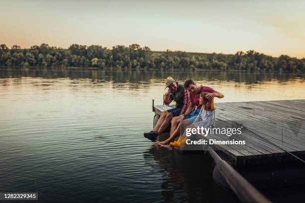 chill time for this three guys - grandpa son stock pictures, royalty-free photos & images