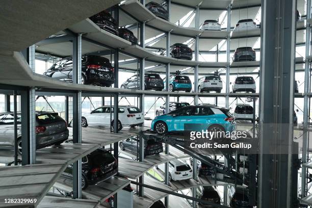Volkswagen ID.3 electric car stands on an elevator platform inside one of the twin towers used as storage at the Autostadt promotional facility next...