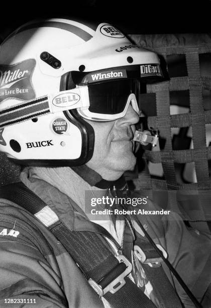 Driver Bobby Allison sits in his racecar prior to the start of the 1985 Daytona 500 stock car race at Daytona International Speedway in Daytona...