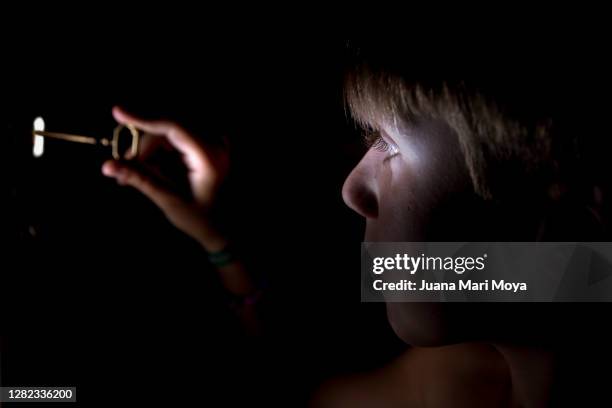 child in the dark with key in a lock - looking through keyhole stock pictures, royalty-free photos & images