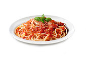 Italian Pasta with Tomato Sauce and Basil Leaves - Isolated