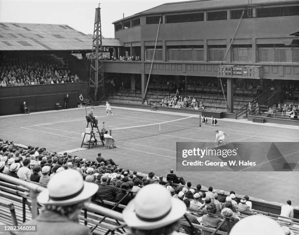 Louise Brough of the United States makes a backhand return to Angela Mortimer on No1 Court during their match of the 28th edition of the Wightman Cup...