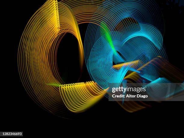 linked circular gold and blue lines - 3d music notes stock pictures, royalty-free photos & images