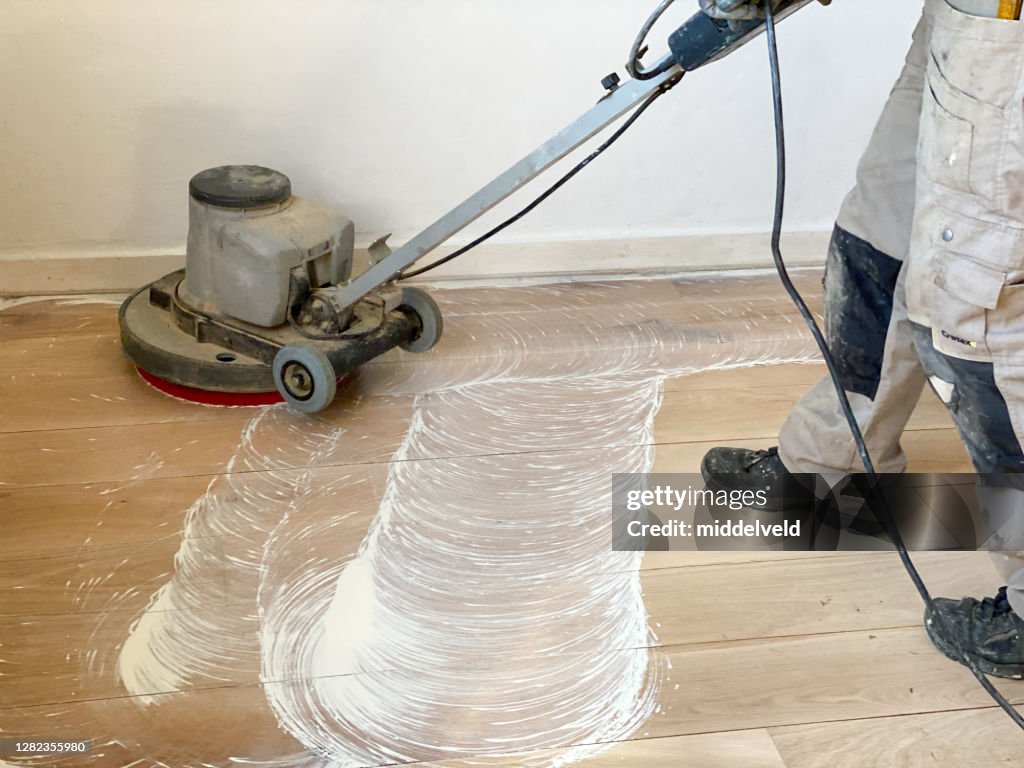 Polishing the oak parquet floor