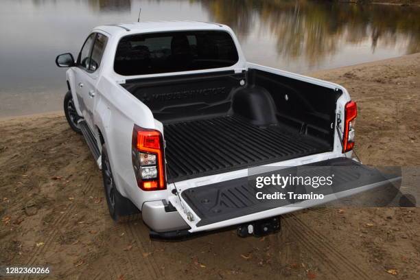 cargo bed in mitsubishi pick-up truck - truck rear view stock pictures, royalty-free photos & images