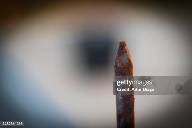 macro photograph of the tip of a rusty nail. - rust   germany stock pictures, royalty-free photos & images
