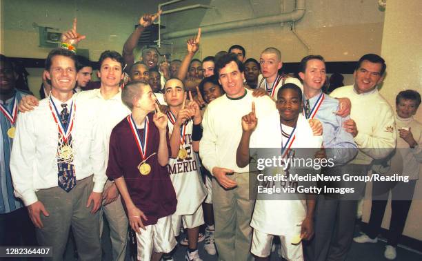 Hershey, PA Lower Merion players celebrate the basketball title at the Hershey arena on March 23, 1996 against Cathedral Prep 48-43. In the back with...