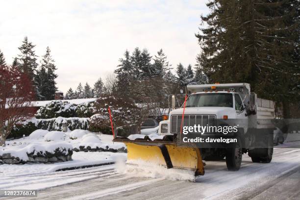 snow plow on city street - plow stock pictures, royalty-free photos & images