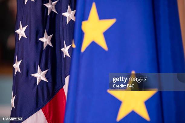 european union and united states flags on display - european union stock pictures, royalty-free photos & images