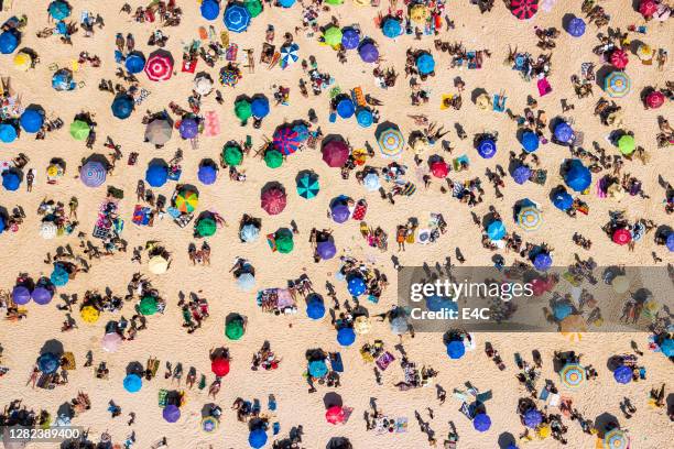 beaches in rio de janeiro amidst high numbers of infected people by the covid-19 - crowded beach stock pictures, royalty-free photos & images