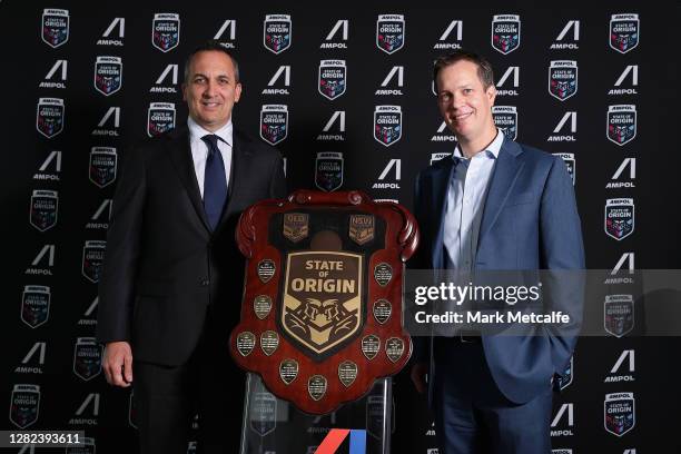 Matt Halliday and NRL CEO Andrew Abdo pose next to the state of origin trophy during a State of Origin media opportunity at Pullman Quay Grand Sydney...