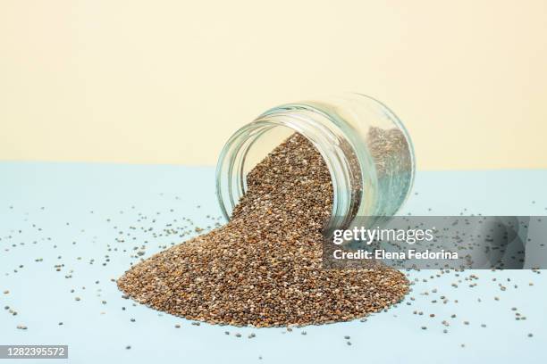 chia seeds in a glass jar. - fibre diététique photos et images de collection
