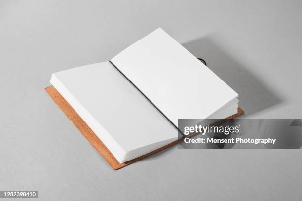 opened a blank magazine book on gray background - diary stock illustrations foto e immagini stock