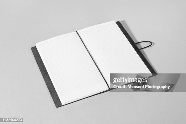 opened a blank magazine book on gray background - magazine spread stock pictures, royalty-free photos & images