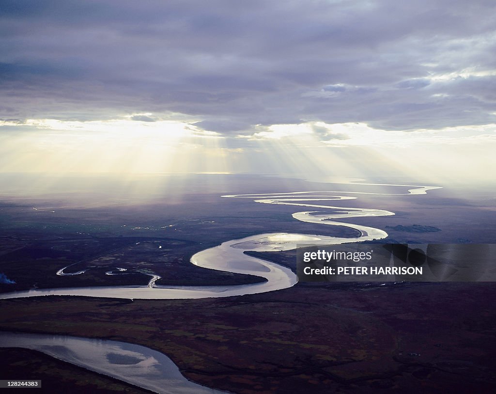 Aerial view of east alligator river w/sunlight under clouds, kakadu, nt