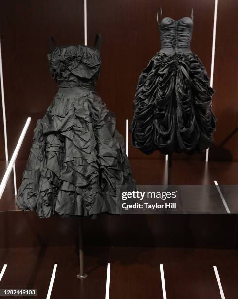 Christian Dior dress and a 1977 Norma Kamali dress are on display at the press preview for the Costume Institute's annual exhibition "About Time:...