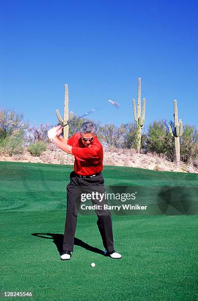 man teeing off on golf course, westin la paloma resort and spa, tucson, arizona - arizona golf stock pictures, royalty-free photos & images