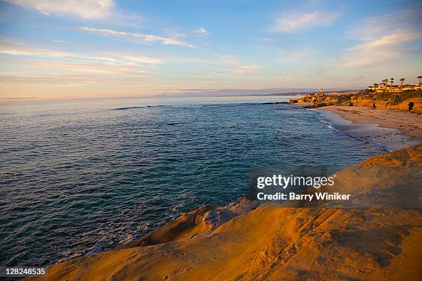 pacific ocean, coastal beach and rocky cliffs, la jolla, california, at sunset - san diego pacific beach stock pictures, royalty-free photos & images