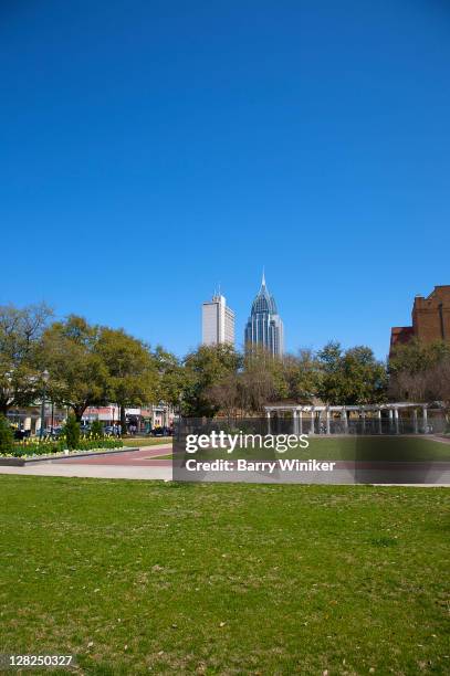 bienville park with downtown office towers in distance, mobile, alabama - mobile alabama stock pictures, royalty-free photos & images