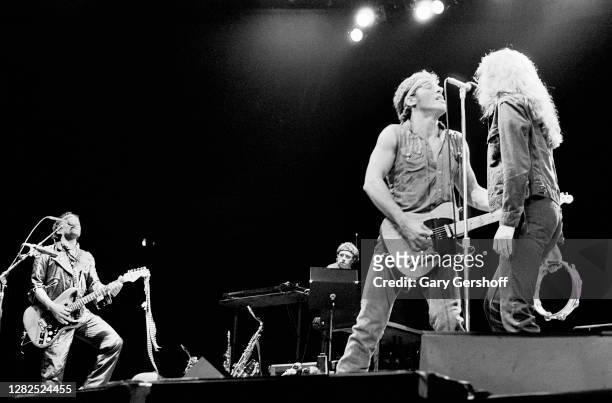 American Rock musicians Bruce Springsteen , on guitar, and backing vocalist Patti Scialfa of the E Street Band perform onstage, during the 'Born in...