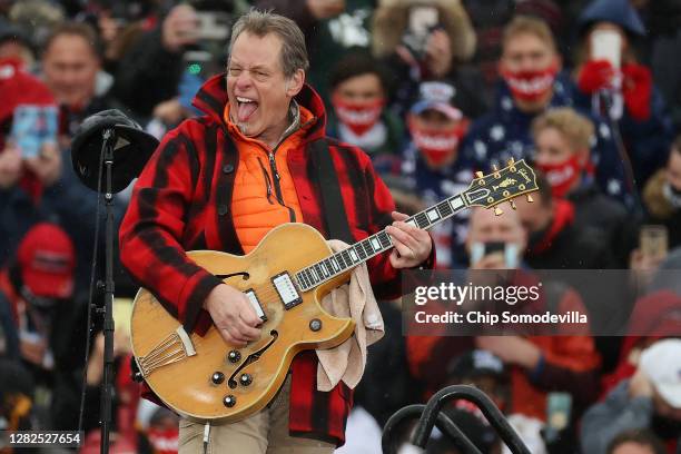 Entertainer and Michigan native Ted Nugent -- also known as the Motor City Madman -- performs the Star Spangled Banner during a campaign rally for...