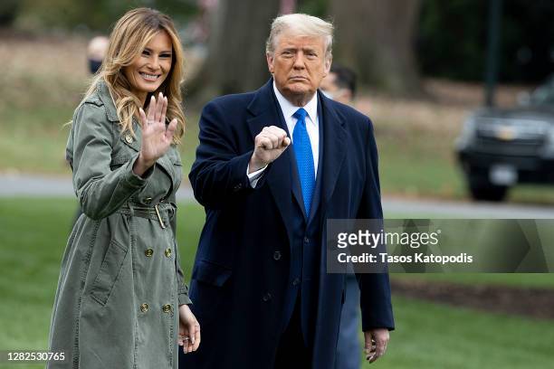 First Lady Melania Trump and President Donald Trump walk on the south lawn of the White House on October 27, 2020 in Washington, DC. President Trump...
