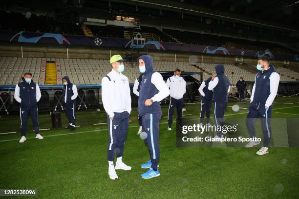 Joaquin Correa and Adam Marusic of SS Lazio arrive at the stadium Jan Breydel to test the field ahead of the UEFA Champions League Group F stage...