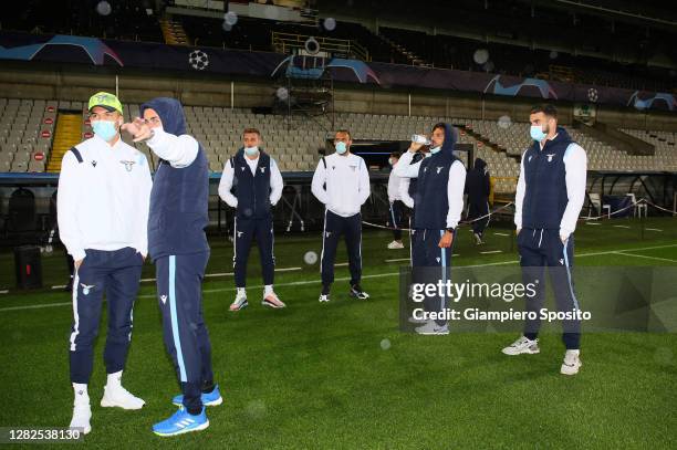 Joaquin Correa and Adam Marusic of SS Lazio arrive at the stadium Jan Breydel to test the field ahead of the UEFA Champions League Group F stage...