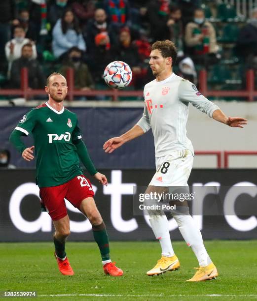 Leon Goretzka of Bayern Munich is challenged by Vladislav Ignatyev of Lokomotiv Moscow during the UEFA Champions League Group A stage match between...